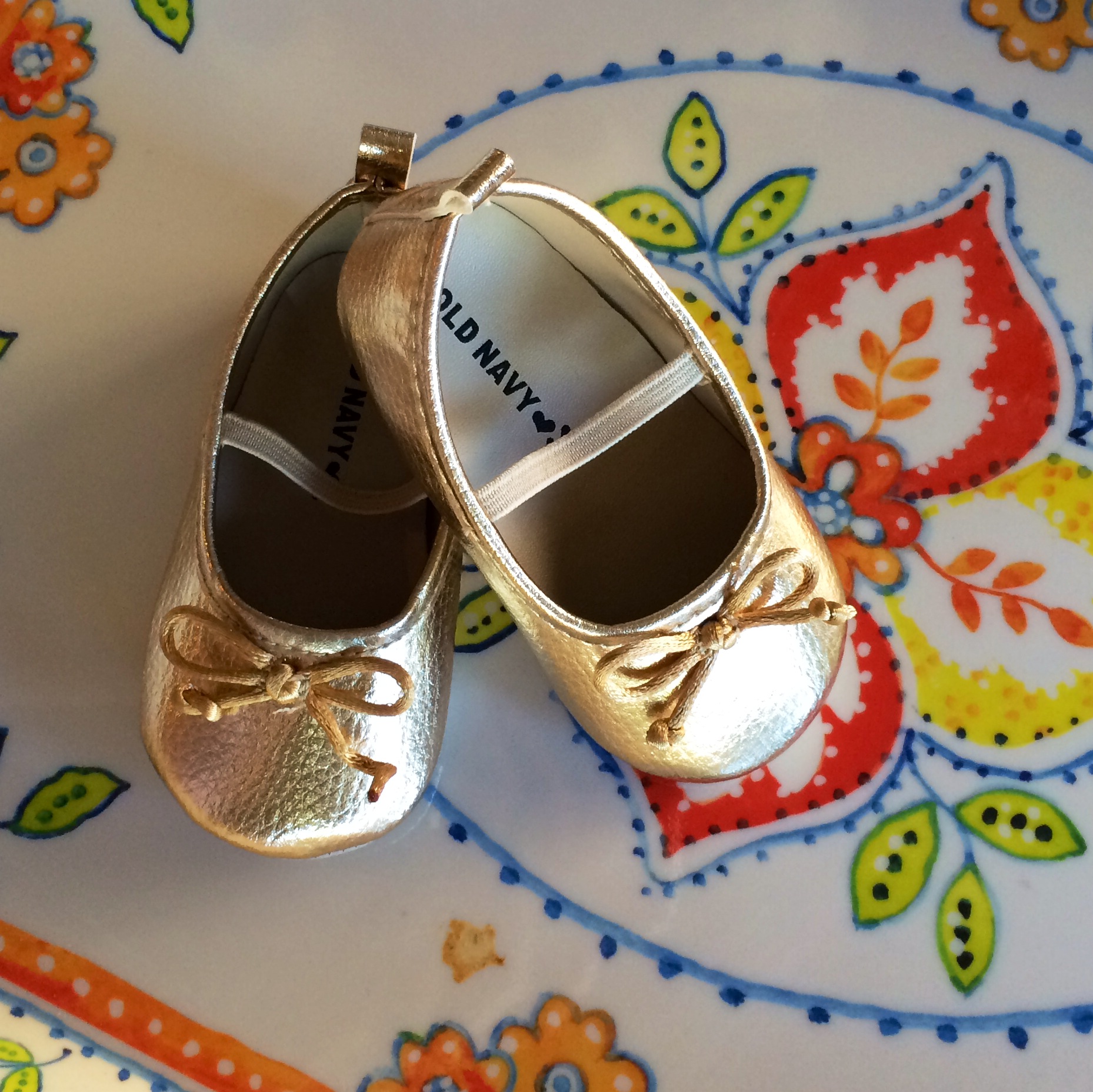 gold baby shoes